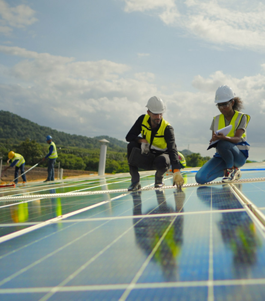 Workers on a solar panel